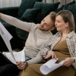 couple planning budget travel map