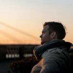 person looking scared at a small insect