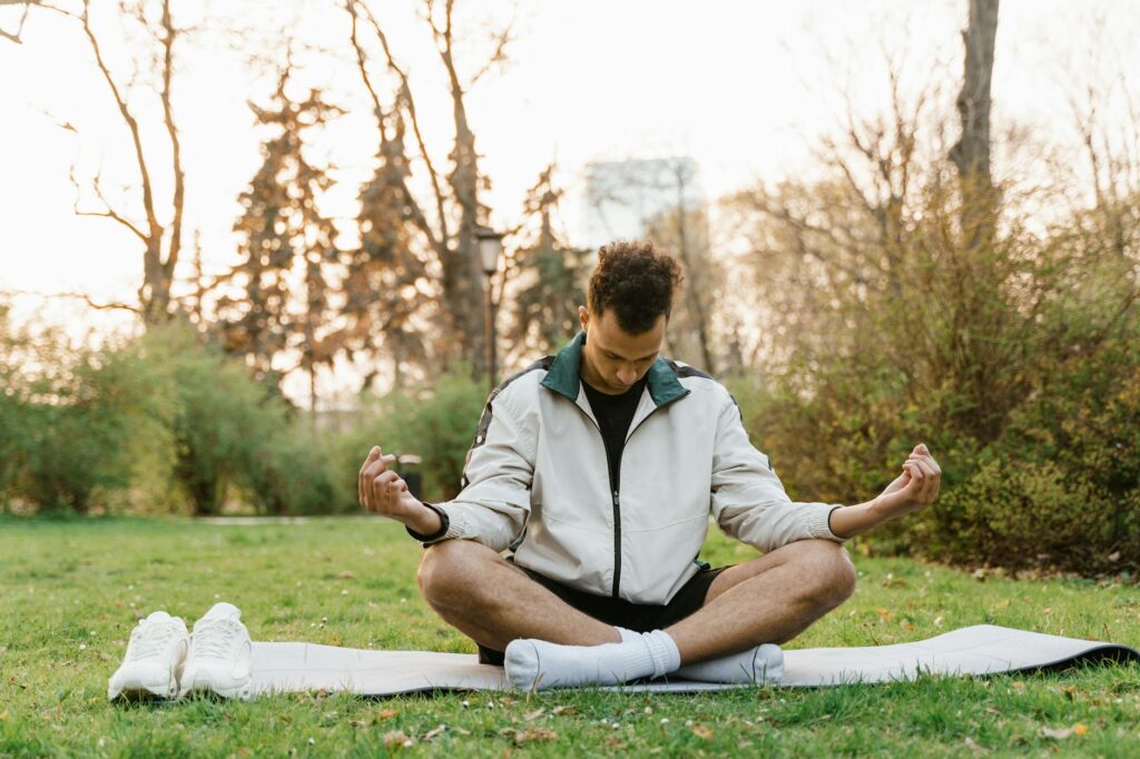 person meditating in cozy room