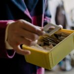 person sorting recycling bin