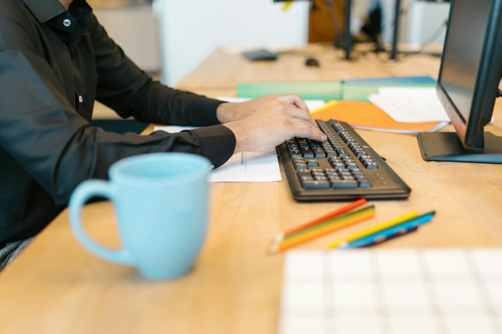 person working diligently at desk