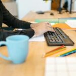 person working diligently at desk