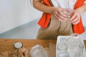 woman sorting recyclables at home